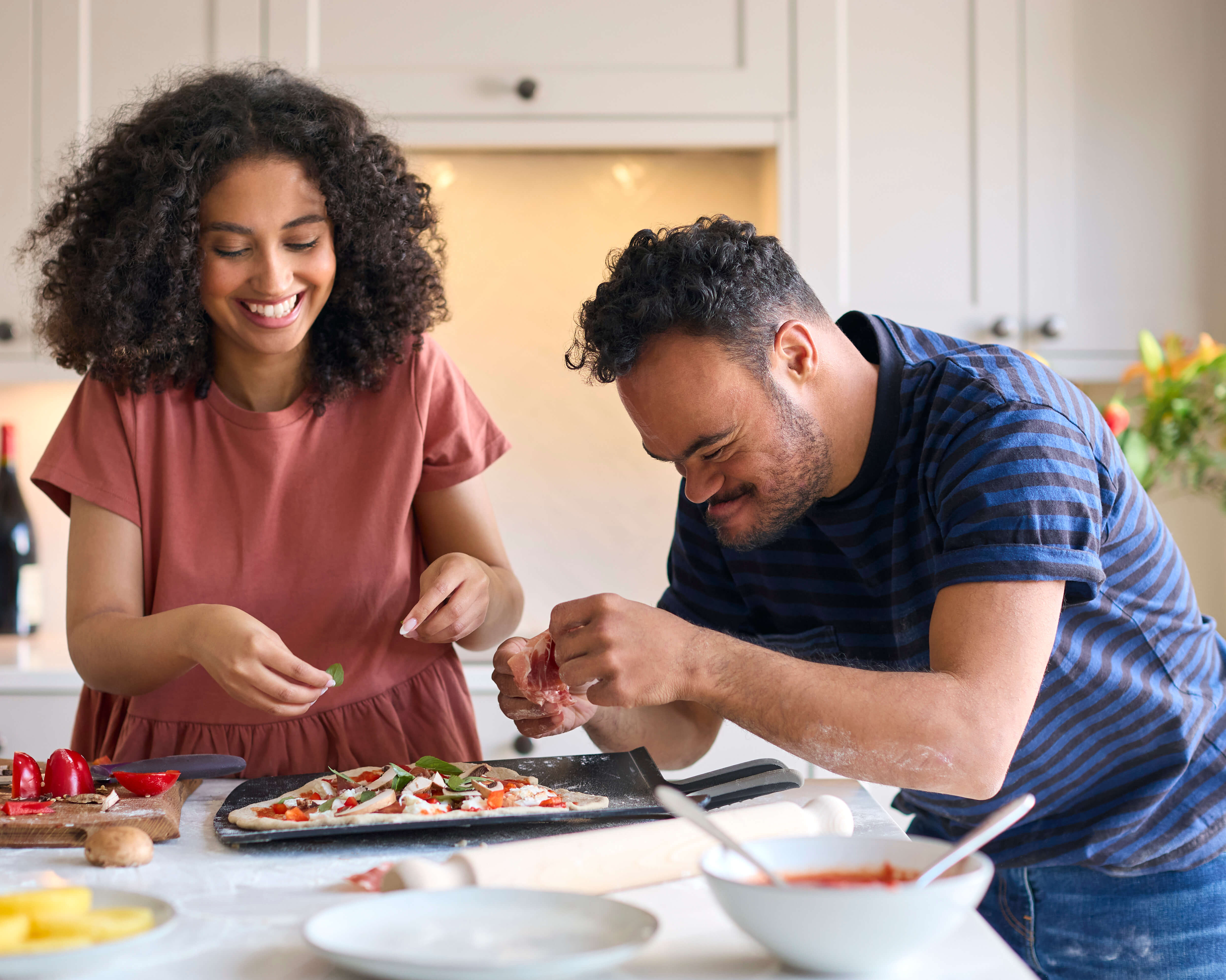 lady helping a man cook