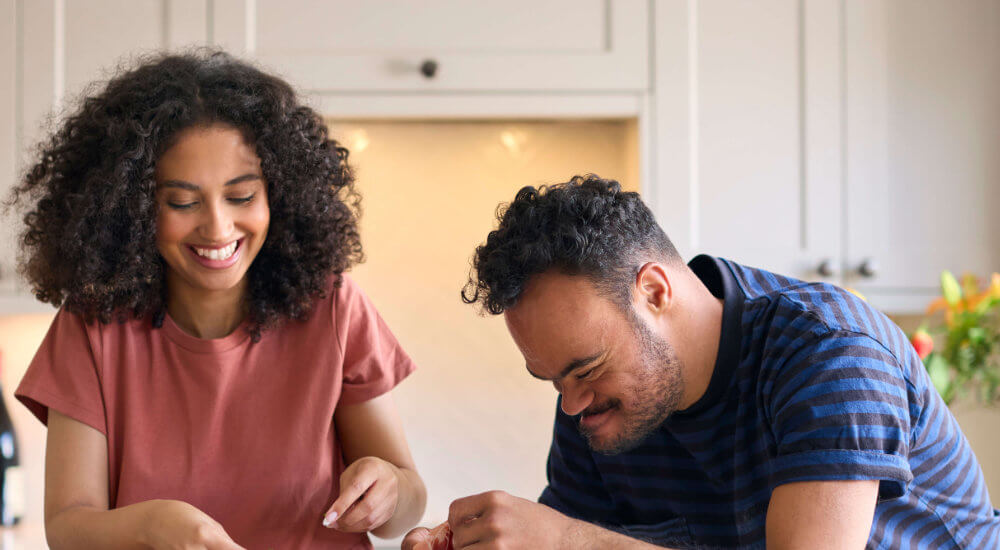 lady helping a man cook